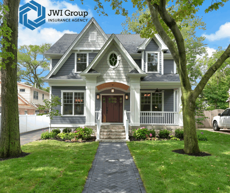 Two-story suburban home with gray siding, white trim, and a manicured front lawn in Westchester County, NY