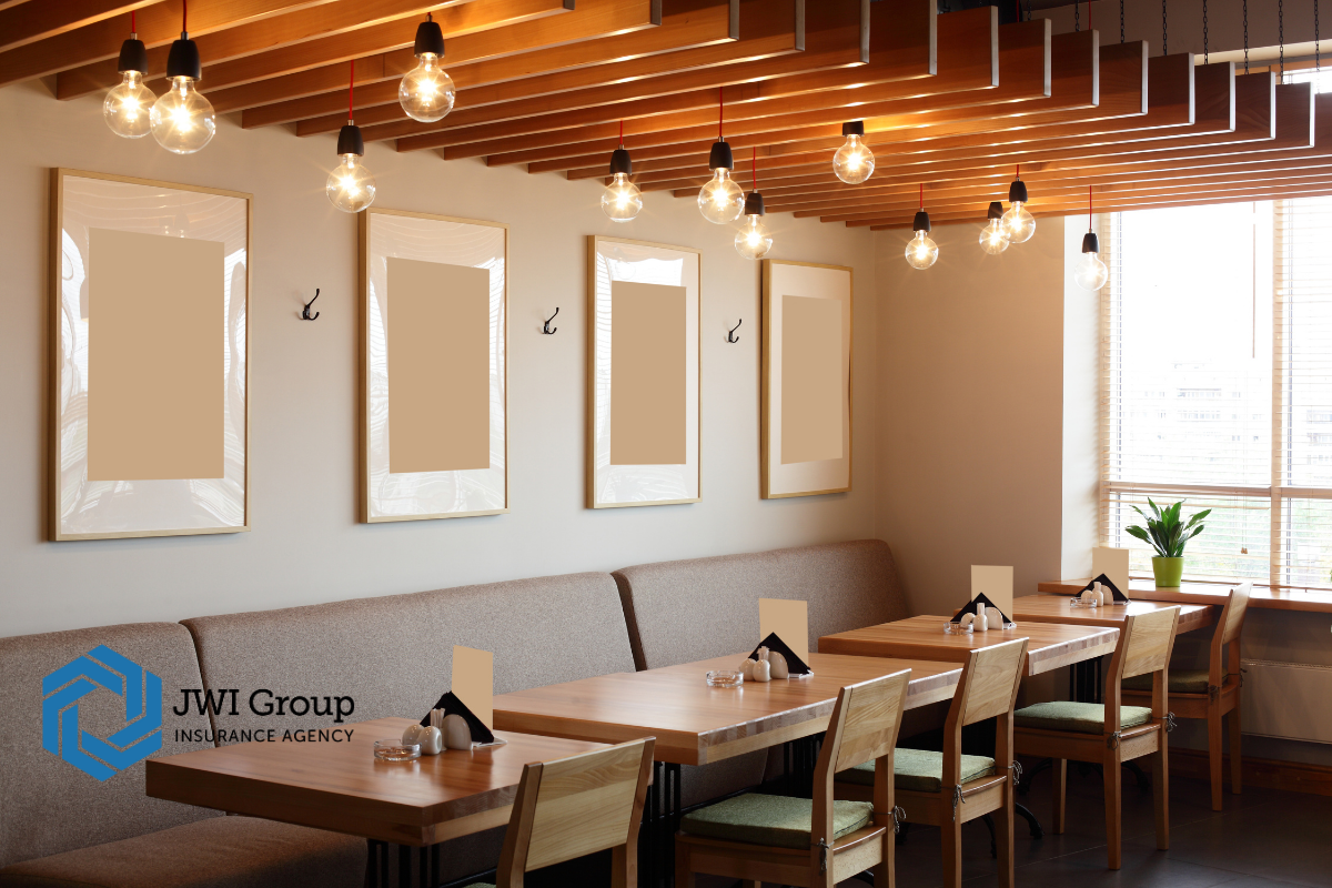 Modern restaurant dining room with warm lighting and neatly set tables, representing a professional, well-maintained space that reduces risk for insurance carriers.