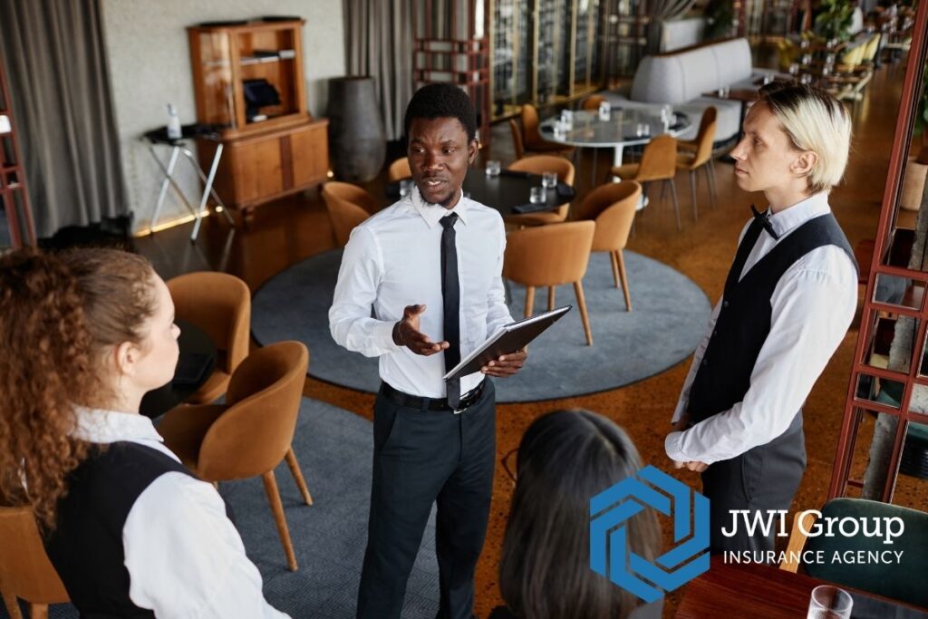 Restaurant dining room with clean tables, modern lighting, and organized seating, showing safety and maintenance for insurance carriers.